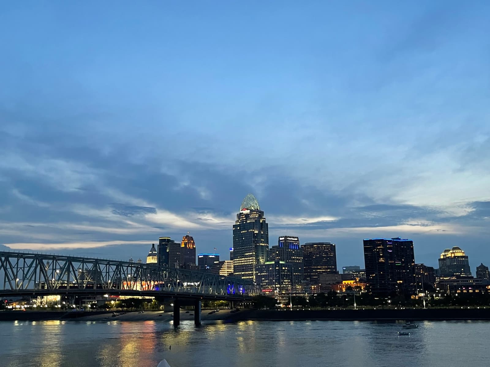 Downtown Cincinnati skyline and the Ohio River at blue hour